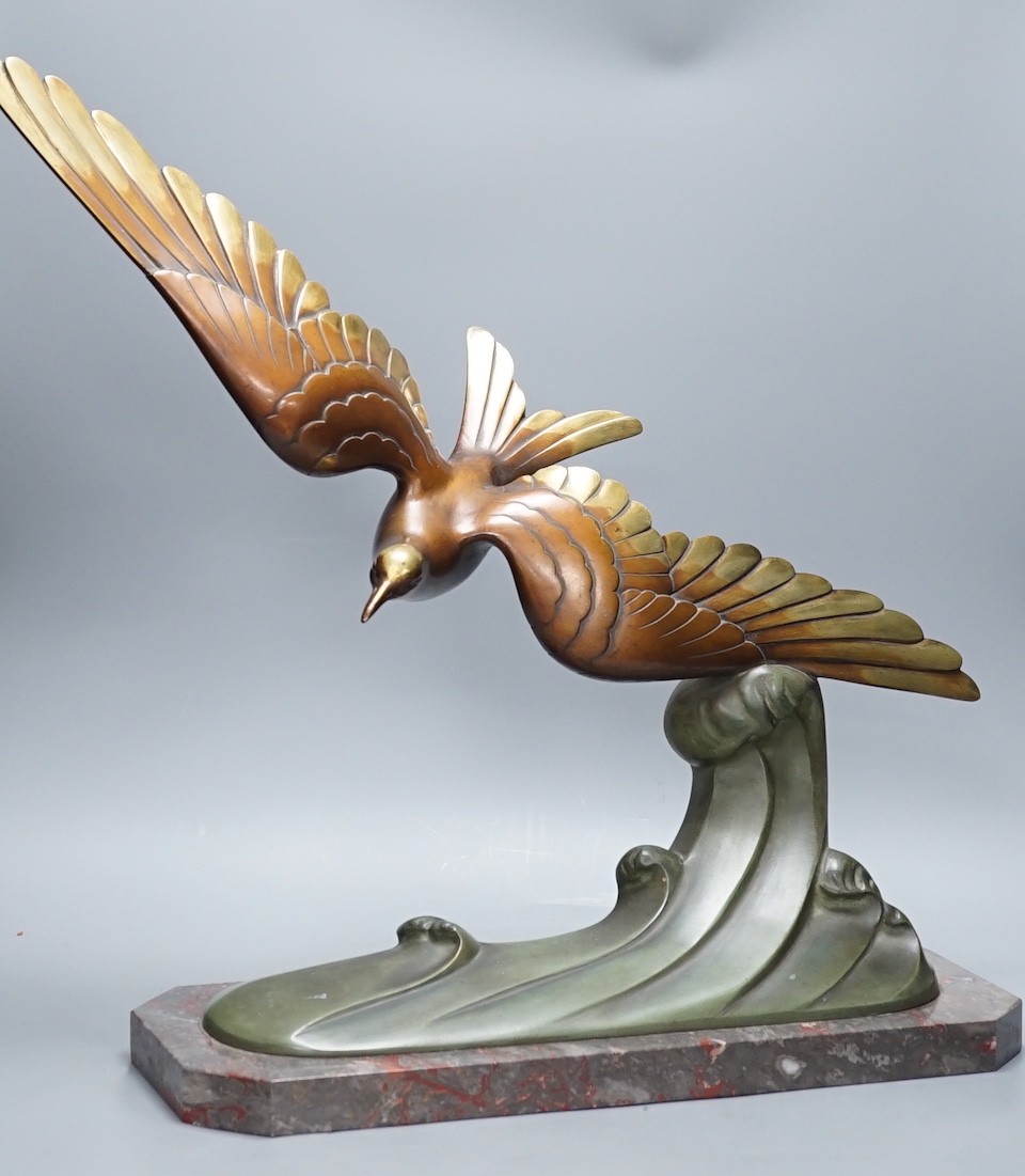 A large Art Deco bronze figure of a seabird, mounted on a marble base, signed Brault, 55.5 cms high